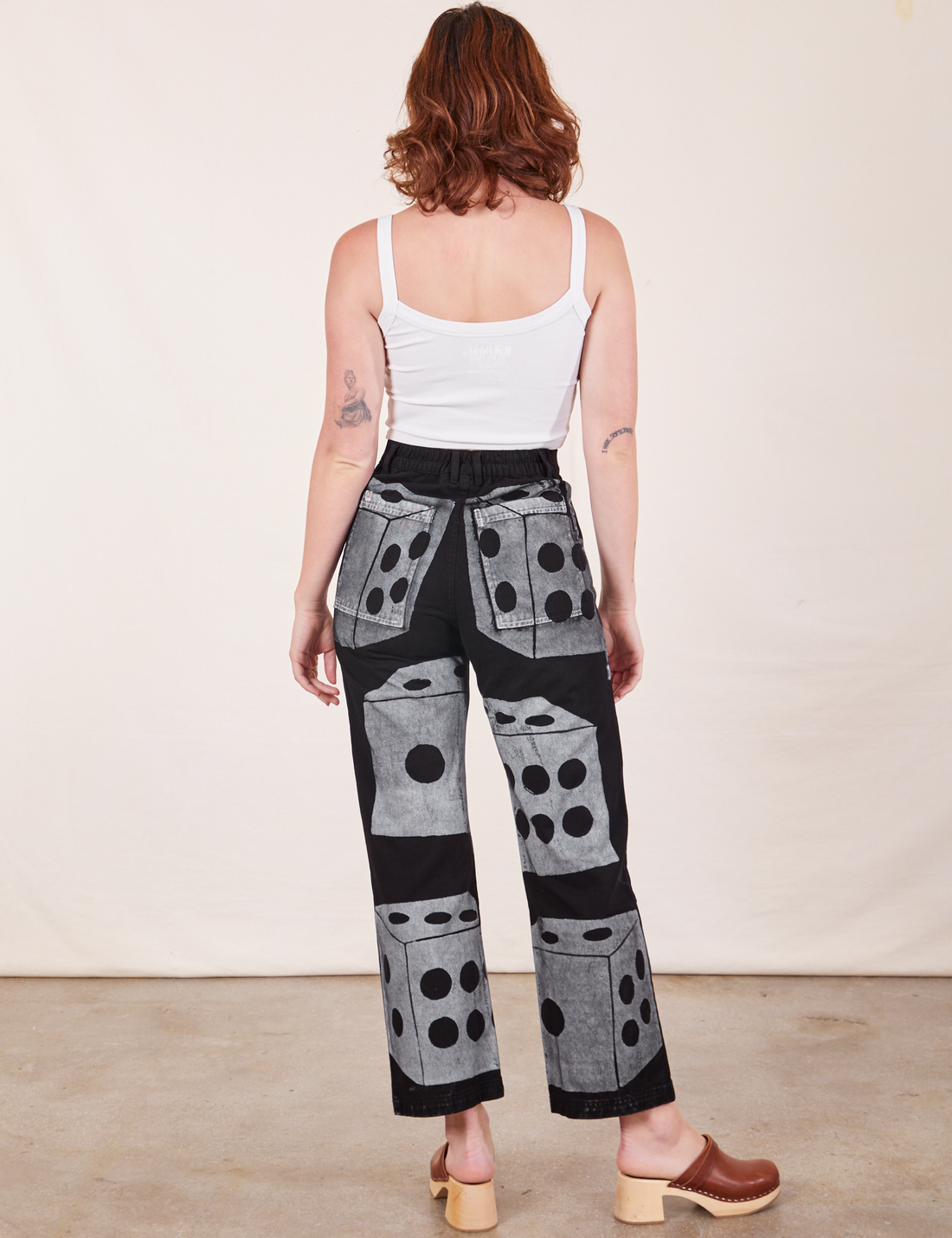 Back view of Icon Work Pants in Dice and vintage off-white Cropped Cami worn by Alex