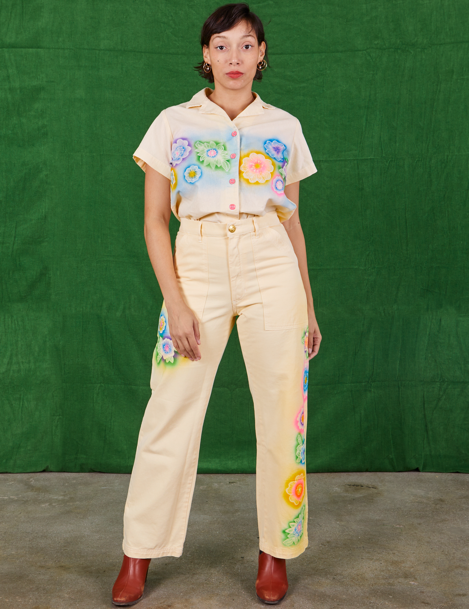 Tiara is wearing Pantry Button-Up in Lace Airbrush and matching Work Pants