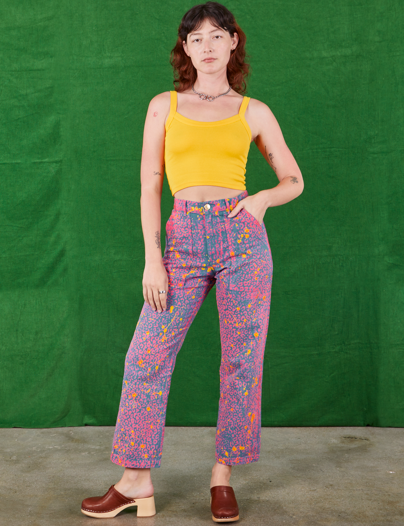Alex is 5&#39;8&quot; and wearing XS Work Pants in Electric Leopard paired with sunshine yellow Cami