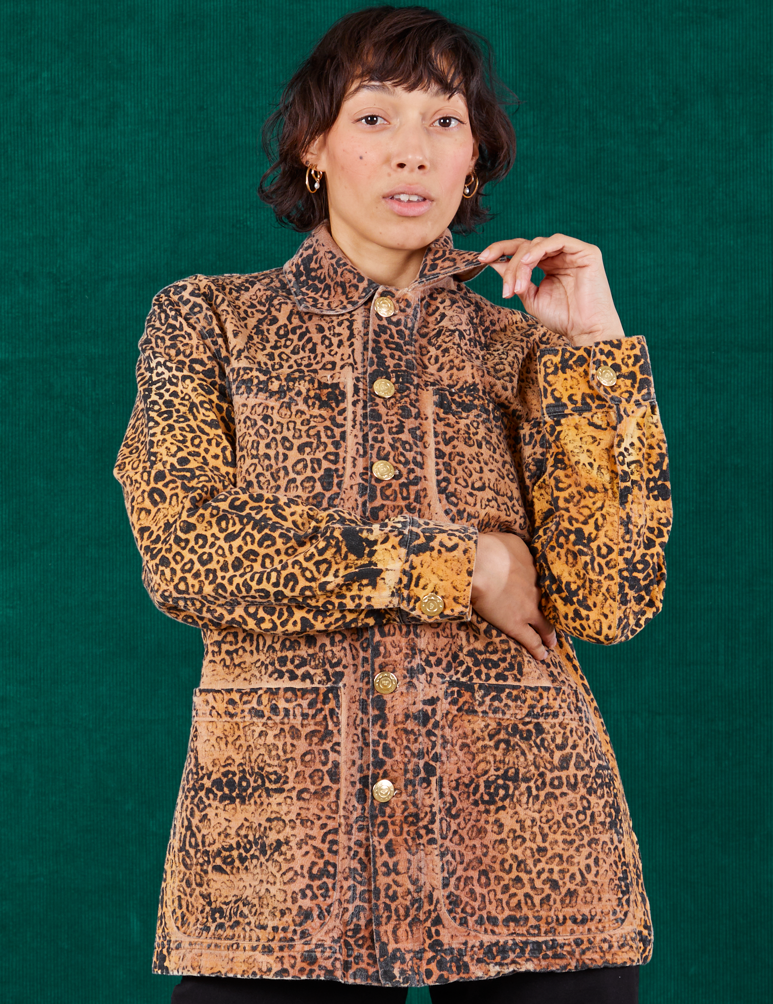 Tiara is wearing a buttoned up Field Coat in Leopard Print