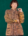 Tiara is wearing a buttoned up Field Coat in Leopard Print