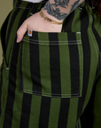 Close up of Sydney's hand in the back pocket of Longline Work Shorts in Evergreen