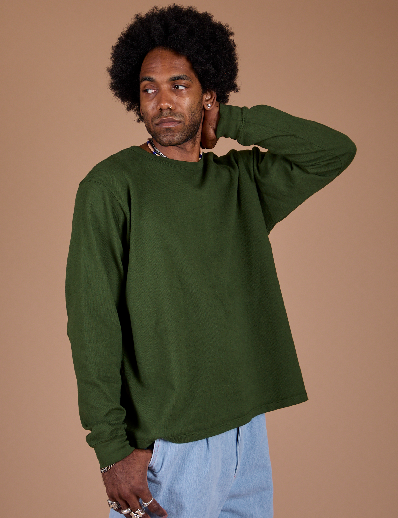 Angled front view of Long Sleeve Burly Tee in Evergreen on Jerrod