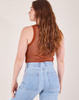 Back view of Mesh Tank Top in Burnt Terracotta and light wash Sailor Jeans worn by Allison