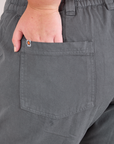 Mid-Rise Work Pants in Slate Grey close up of Juliet's hand in the back pocket