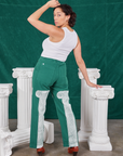 Back view of Column Work Pants in Hunter Green and vintage off-white Cropped Tank Top
