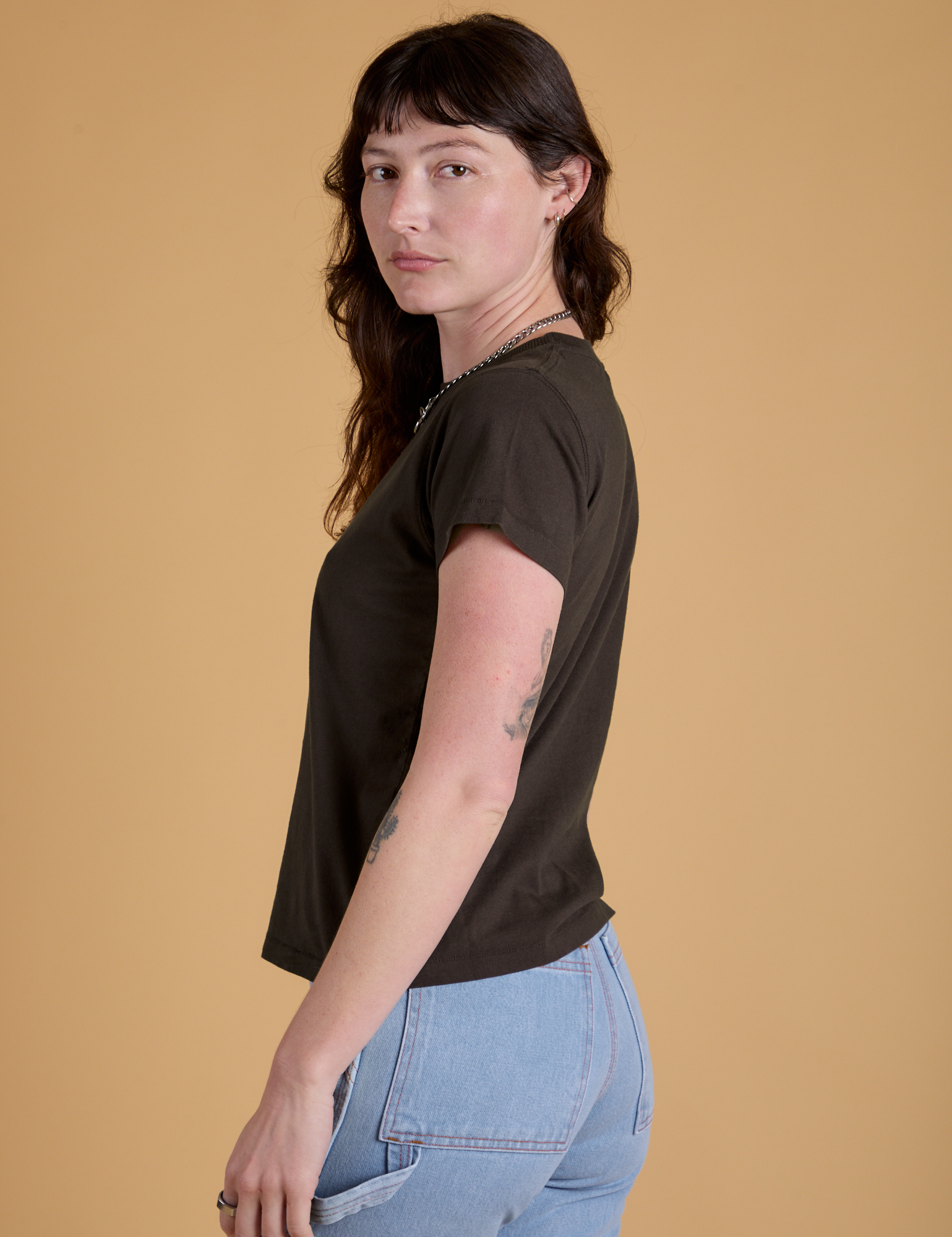 Side view of Organic Vintage Tee in Espresso Brown on Alex