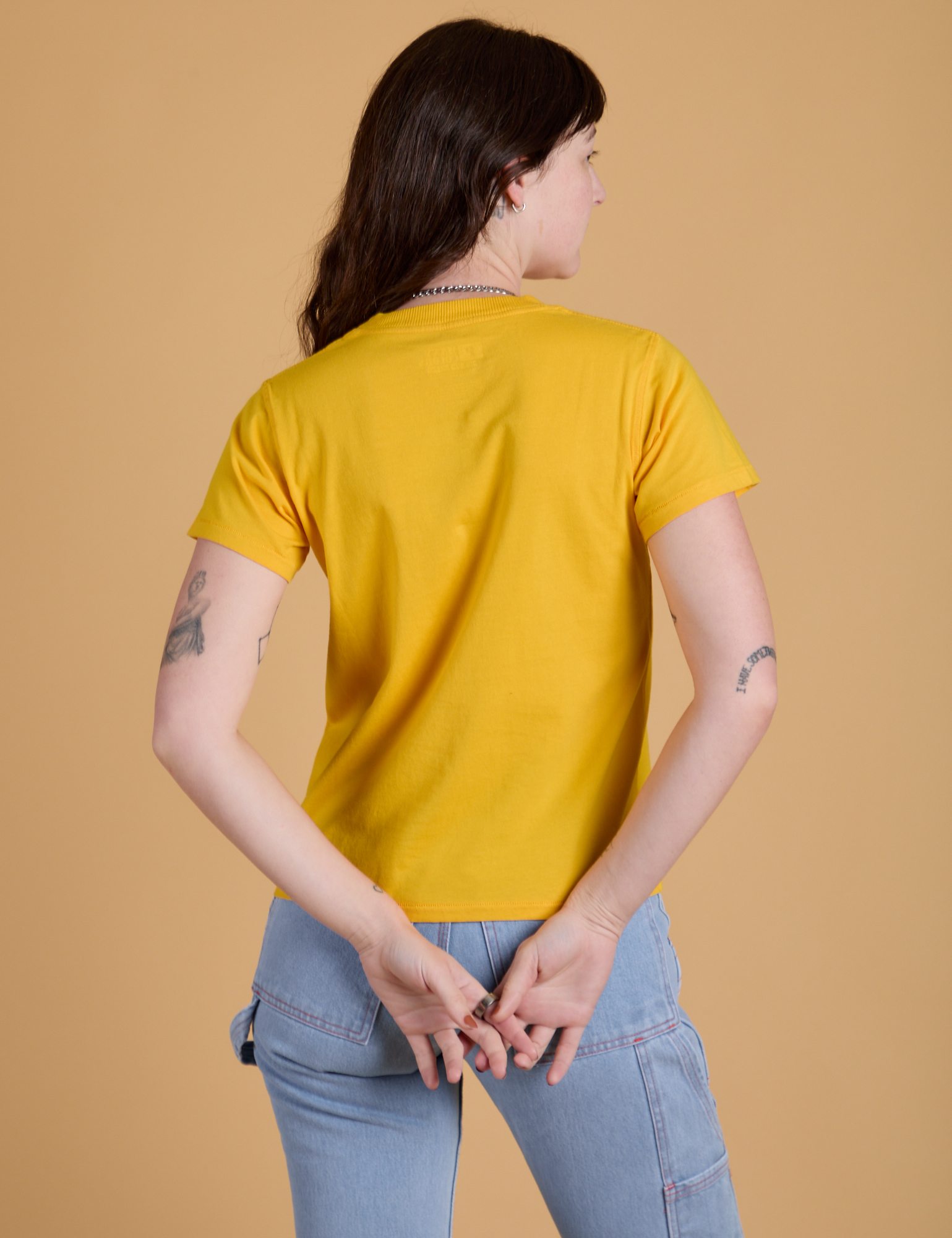 Organic Vintage Tee in Sunshine Yellow back view on Alex