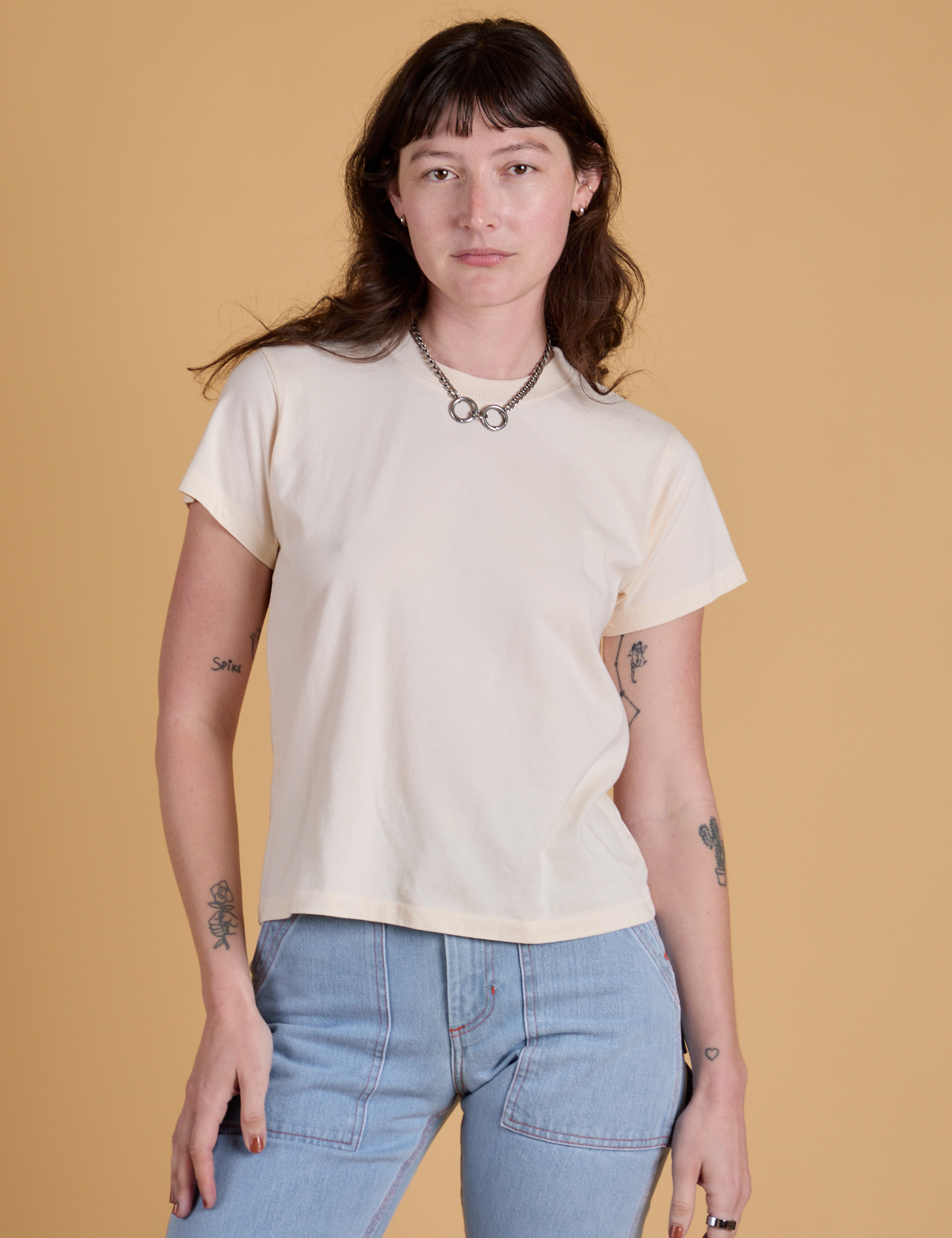 Alex is 5’8” and wearing P Organic Vintage Tee in Vintage Off White