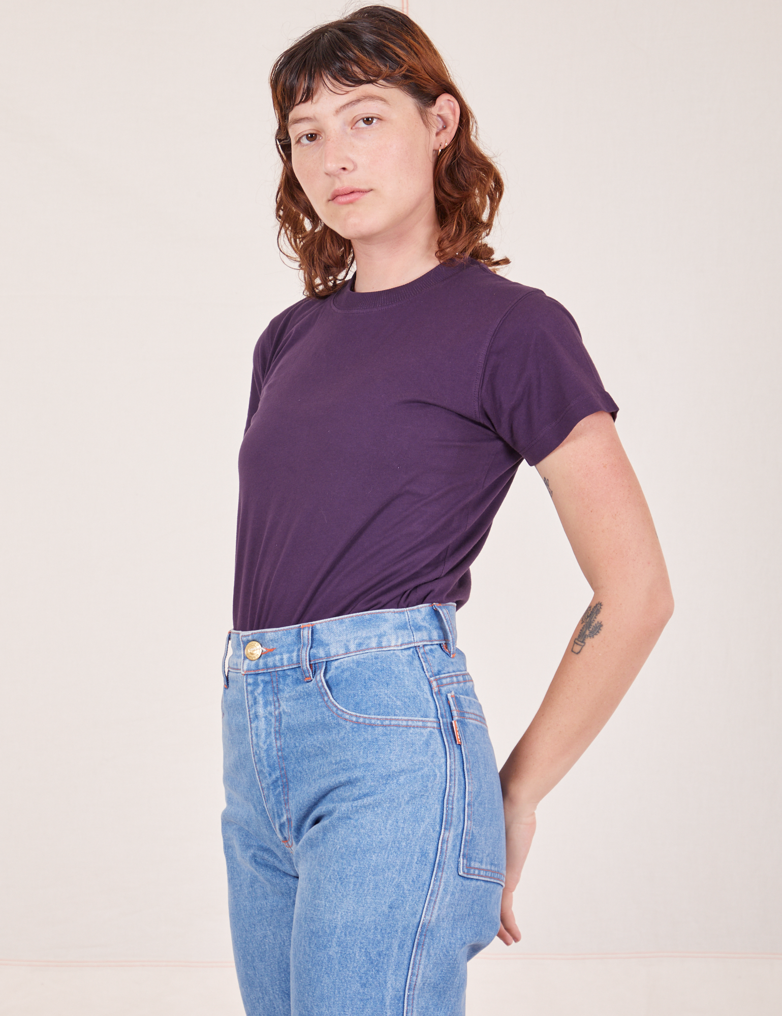 Angled view of The Organic Vintage Tee in Nebula Purple worn by Alex