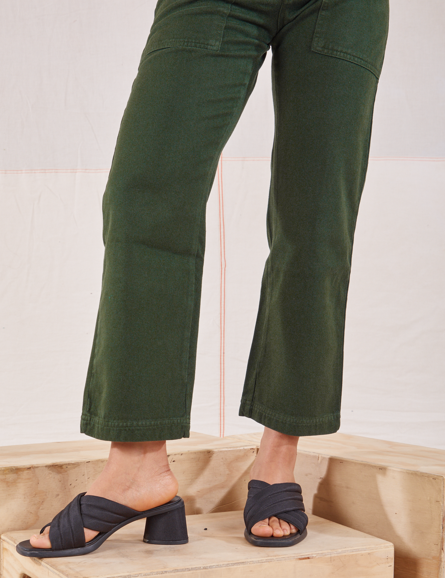 Organic Work Pants in Swamp Green pant leg close up on Mika