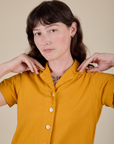Pantry Button-Up in Mustard Yellow front close up on Alex