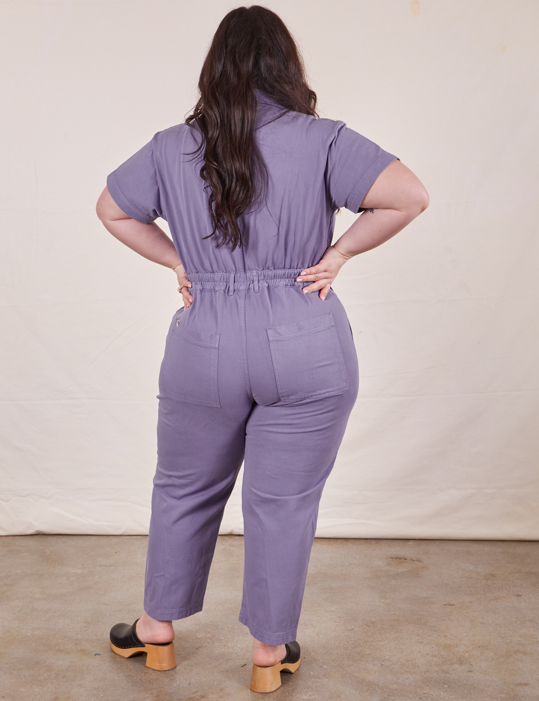 Petite Short Sleeve Jumpsuit in Faded Grape back view on Ashley