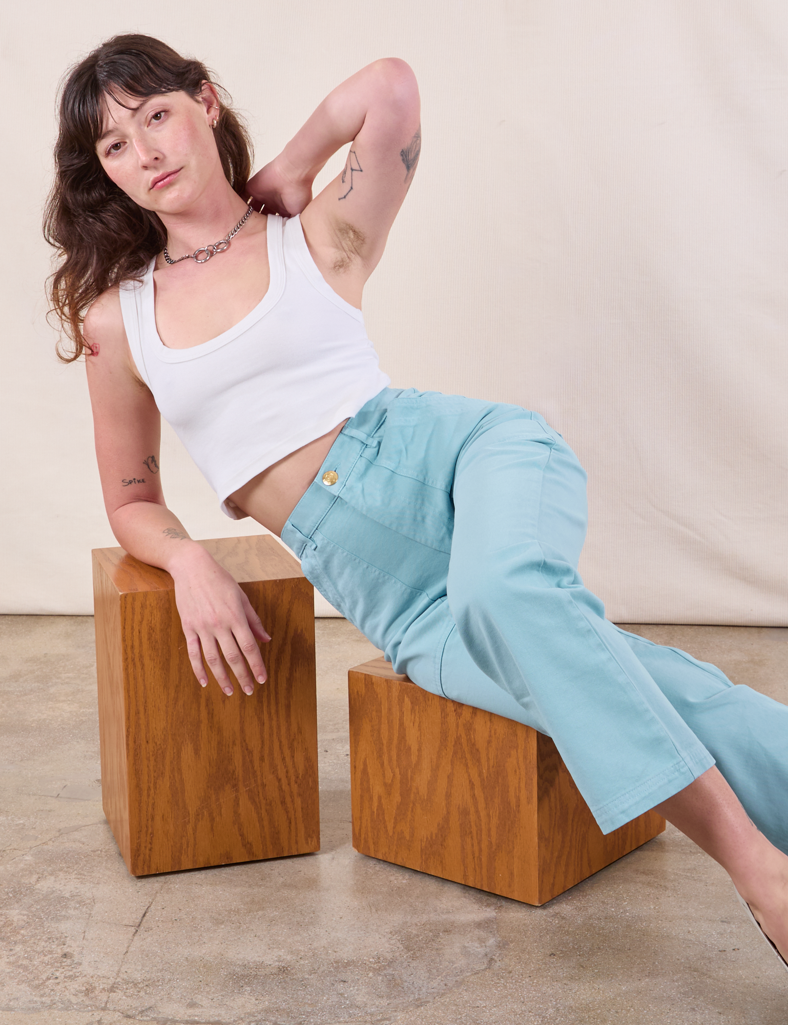 Alex is wearing Work Pants in Baby Blue and Cropped Tank in Vintage Tee Off-White