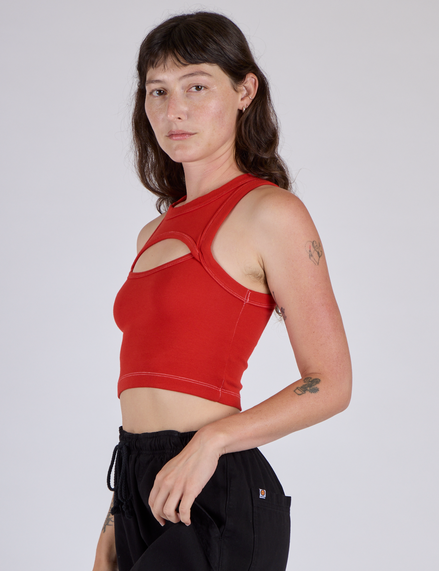 Side View of Alex in the Mustang Red Porthole Tank