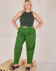 Lish is wearing Racerback Tank in Swamp Green and lawn green Trousers