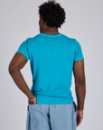 Jr. Varsity Tee in Hawaiian Blue back view on Isaac