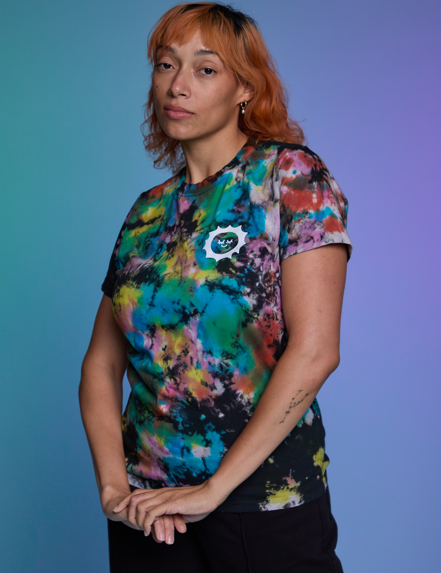 Angled front view of Classic Tee in Rainbow Magic Waters on Tiara