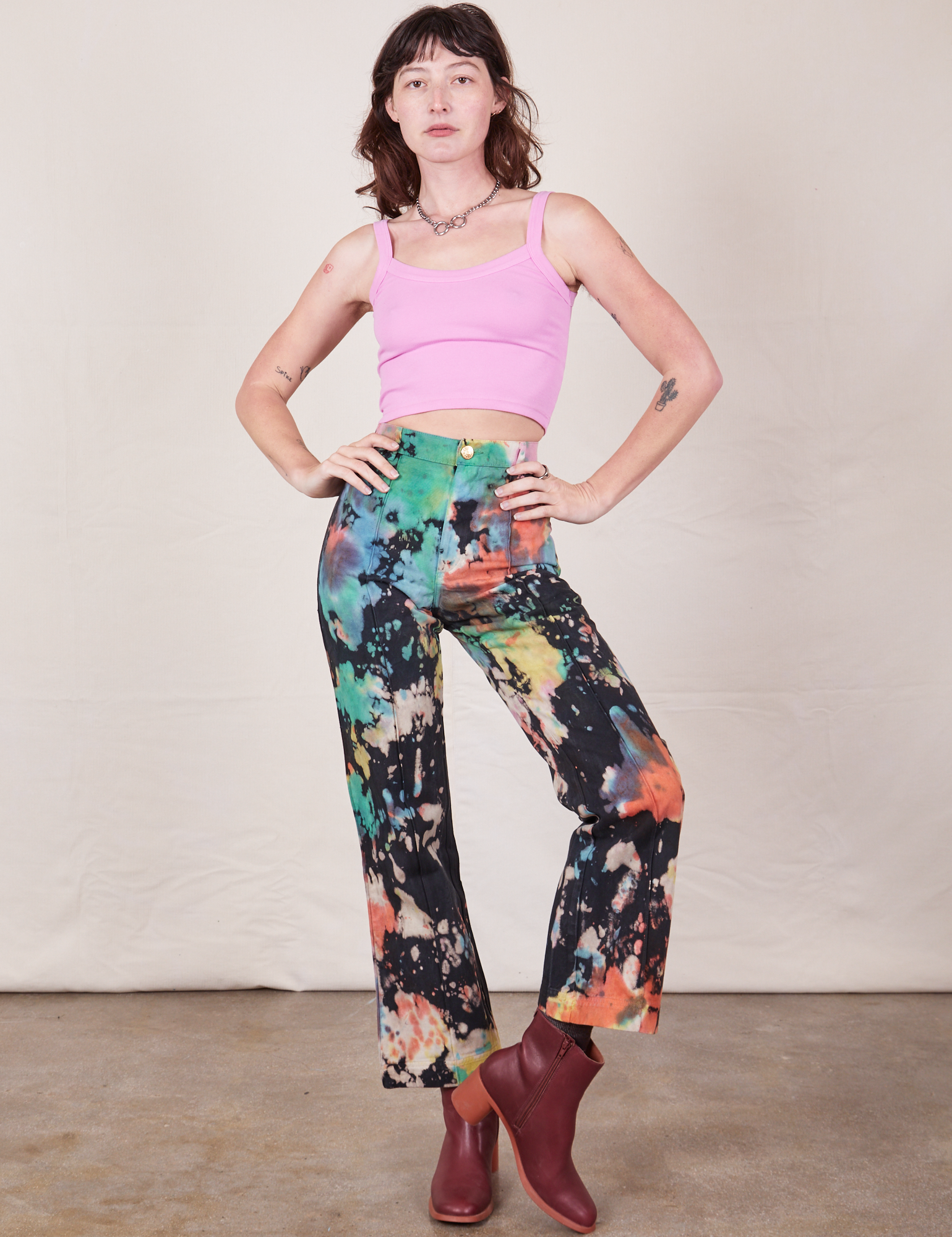 Alex is 5&#39;8&quot; and wearing XXS Western Pants in Rainbow Magic Waters paired with bubblegum pink Cami