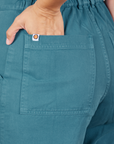 Back pocket close up of Short Sleeve Jumpsuit in Marine Blue worn by Tiara