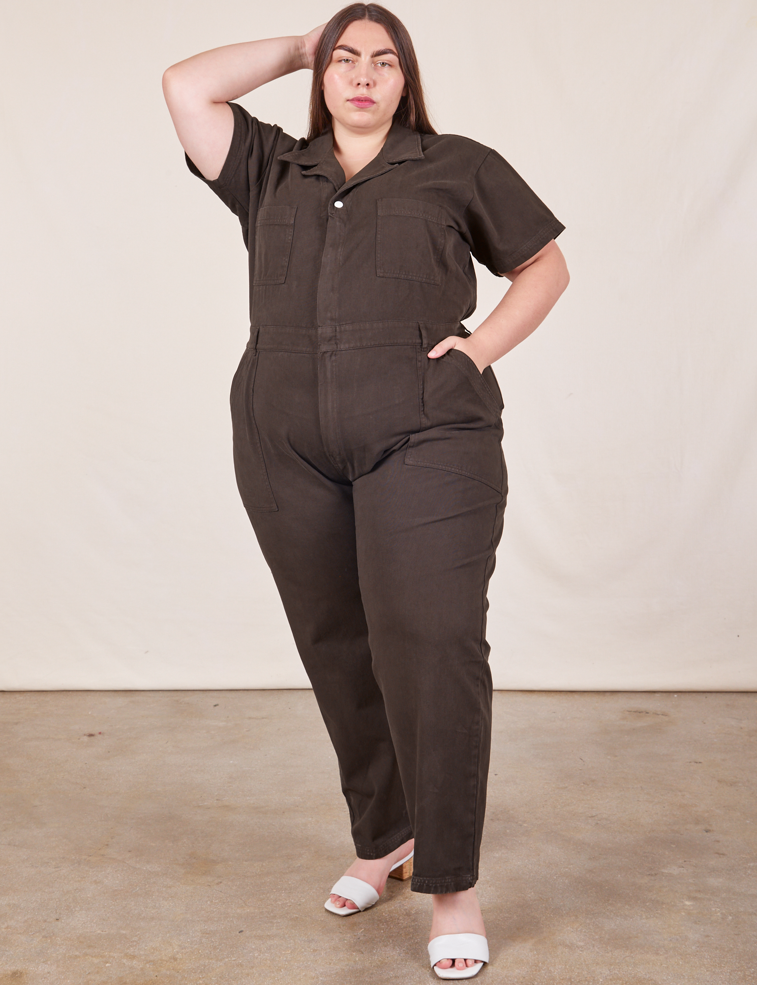 Marielena is 5’8” and wearing 2XL Short Sleeve Jumpsuit in Espresso Brown 