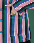 Close up of Sydney's hand in the front pocket of Stripe Work Jacket in Pacific Stripe