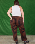 Back view of Black Stripe Work Pants in Fudgesicle Brown and Cropped Tank on Katie