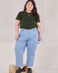 Ashley is wearing Organic Vintage Tee in Swamp Green tucked into light wash Carpenter Jeans
