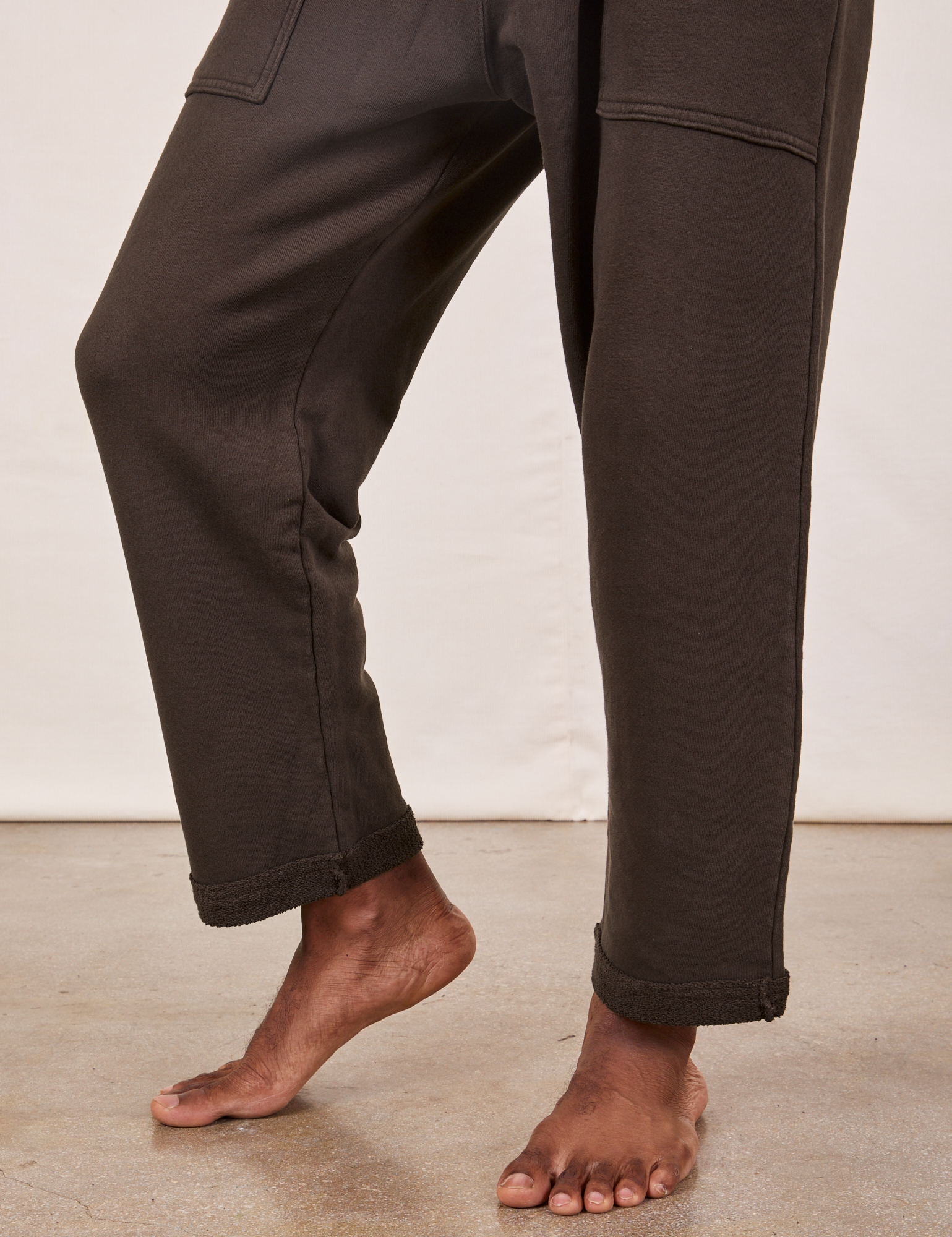 Cropped Rolled Cuff Sweatpants in Espresso Brown pant leg close up on Jerrod