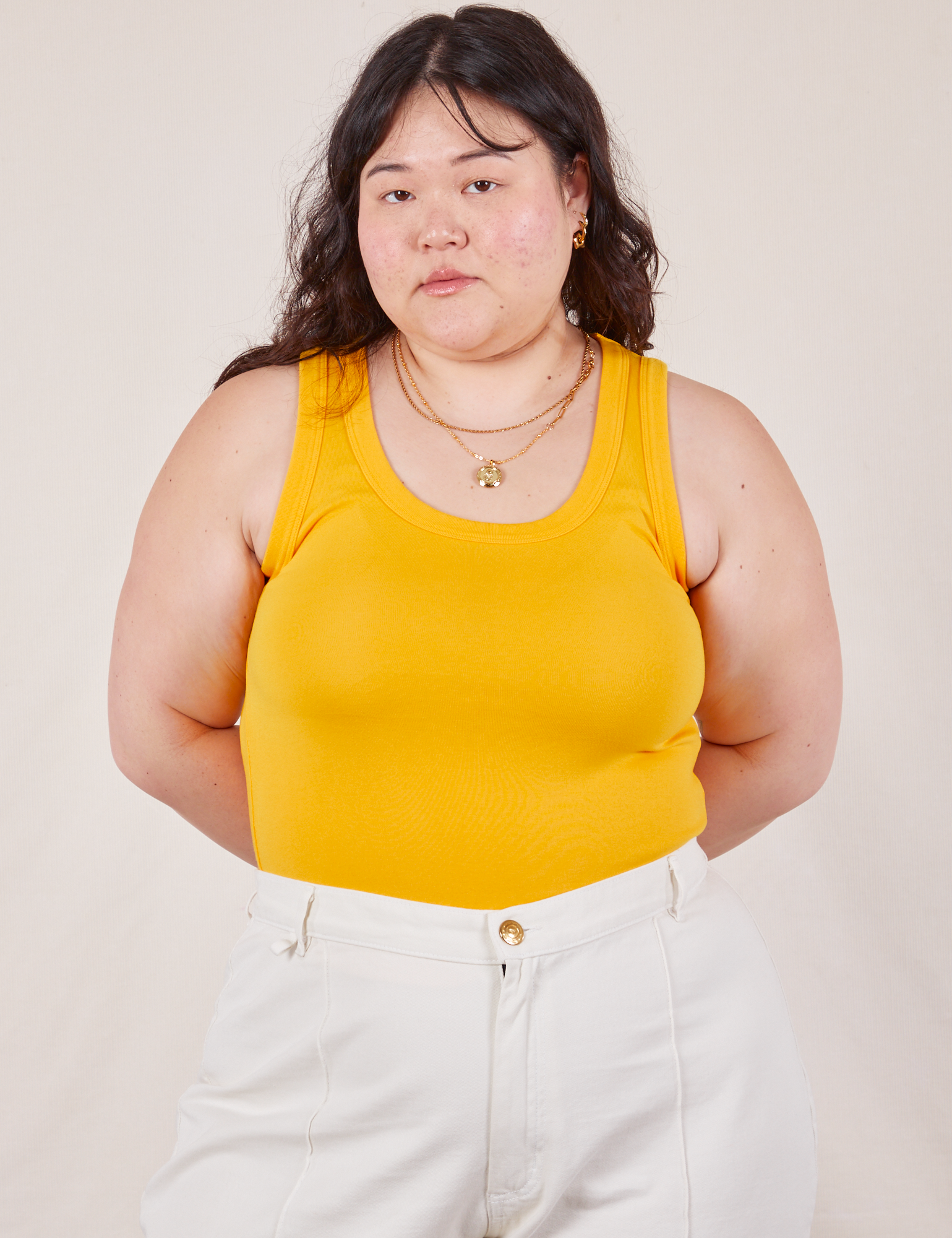 Ashley is 5’7” and wearing L Tank Top in Sunshine Yellow