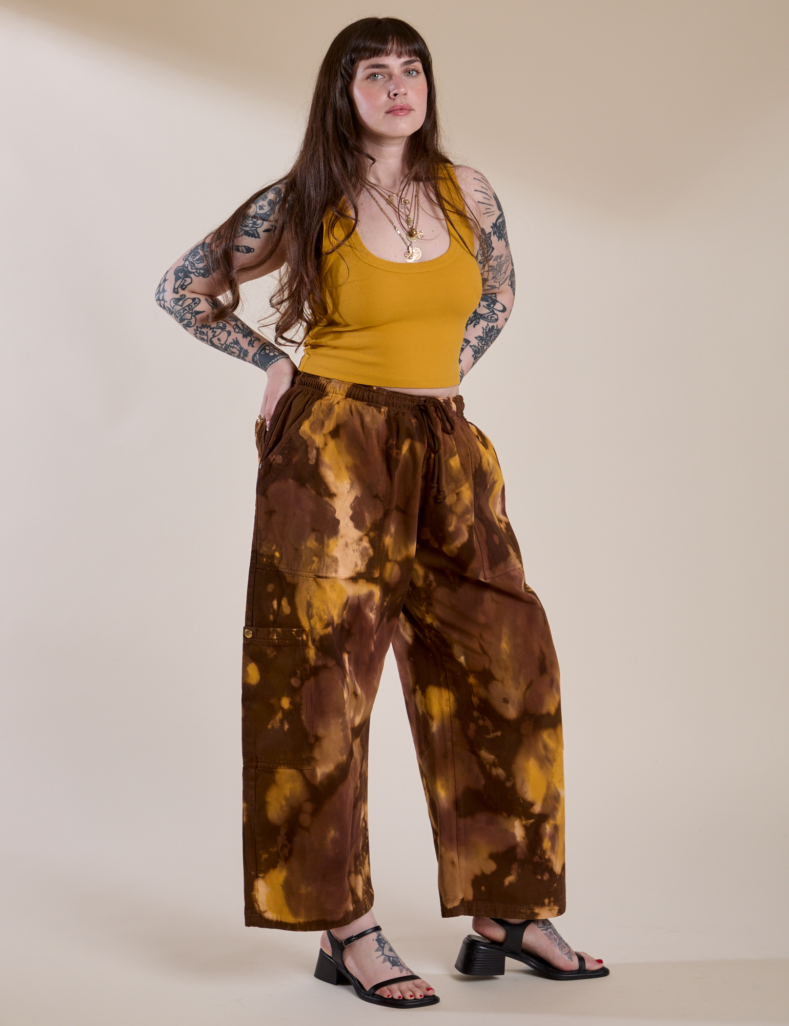 Angled front view of Magic Waters Drop Pocket Pants in Honey Brown and mustard yellow Cropped Tank on Sydney
