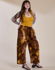 Angled front view of Magic Waters Drop Pocket Pants in Honey Brown and mustard yellow Cropped Tank on Sydney
