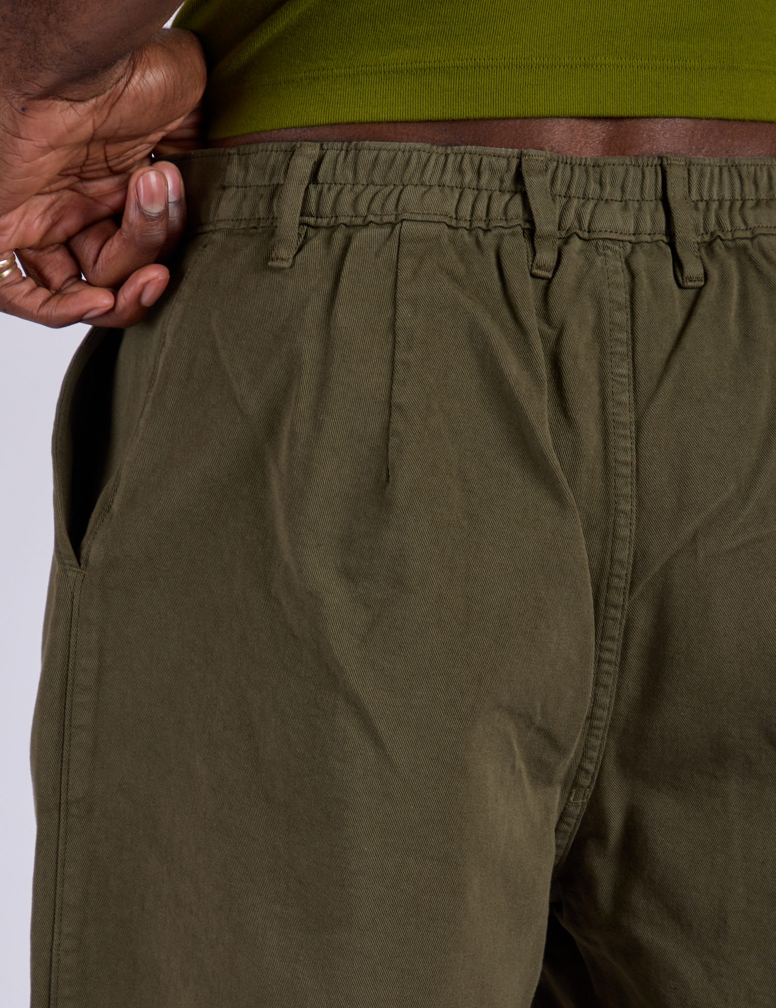 Pleated Trouser Shorts in Surplus Green back close up of elastic waistband on Jerrod