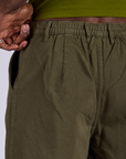 Pleated Trouser Shorts in Surplus Green back close up of elastic waistband on Jerrod