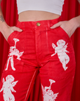 Airbrush Cupid Work Pants front close up on Alex