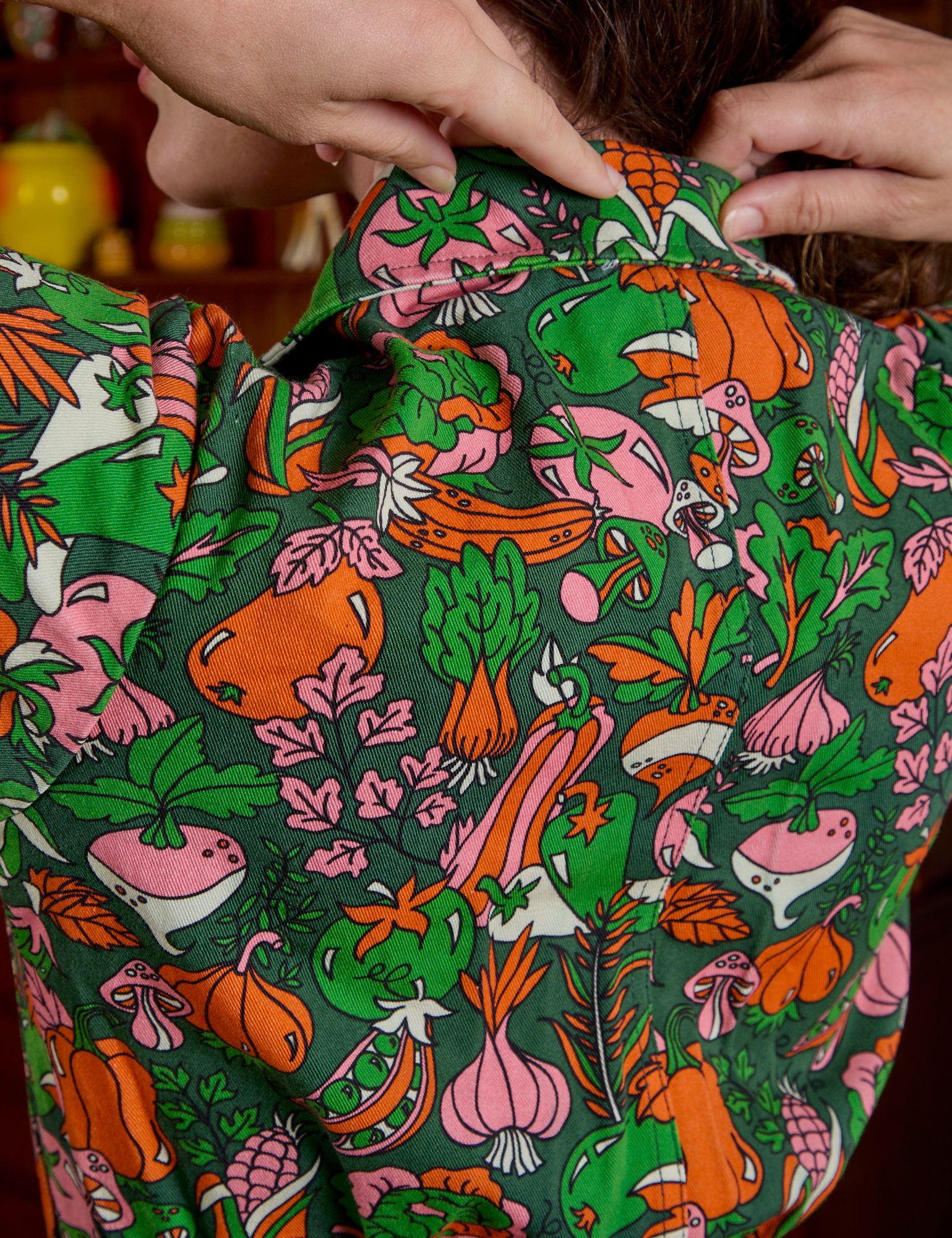 Short Sleeve Jumpsuit in Kitchen Collection back view close up on Alex. 