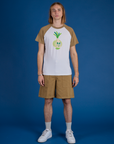 Grant is wearing Produce Raglan Tee in Onion