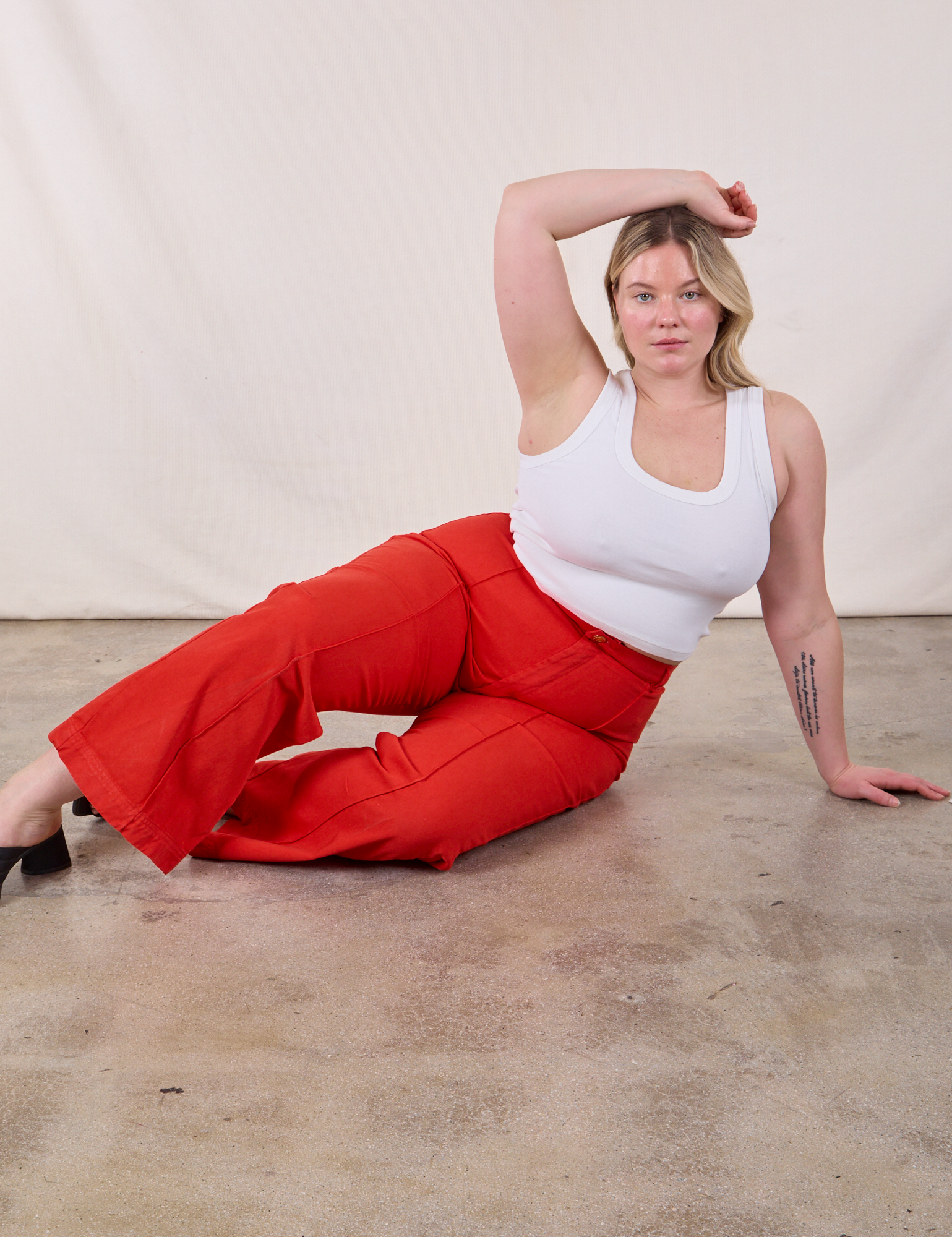 Western Pants in Mustang Red and Cropped Tank in Vintage Tee Off-White worn by Lish