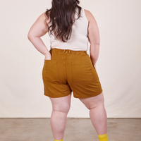 Back view of Classic Work Shorts in Spicy Mustard and vintage off-white Tank Top worn by Ashley