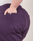 Classic Work Shorts in Nebula Purple back pocket close up. Ashley has her hand in the pocket.