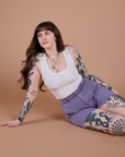 Sydney is wearing Classic Work Shorts in Faded Grape and Cropped Tank in Vintage Tee White
