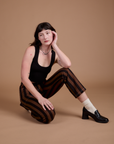 Black Stripe Work Pants in Fudgesicle Brown and black Cropped Tank on Alex