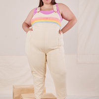 Marielena is wearing Rainbow Overalls and bubblegum pink Cropped Tank Top underneath
