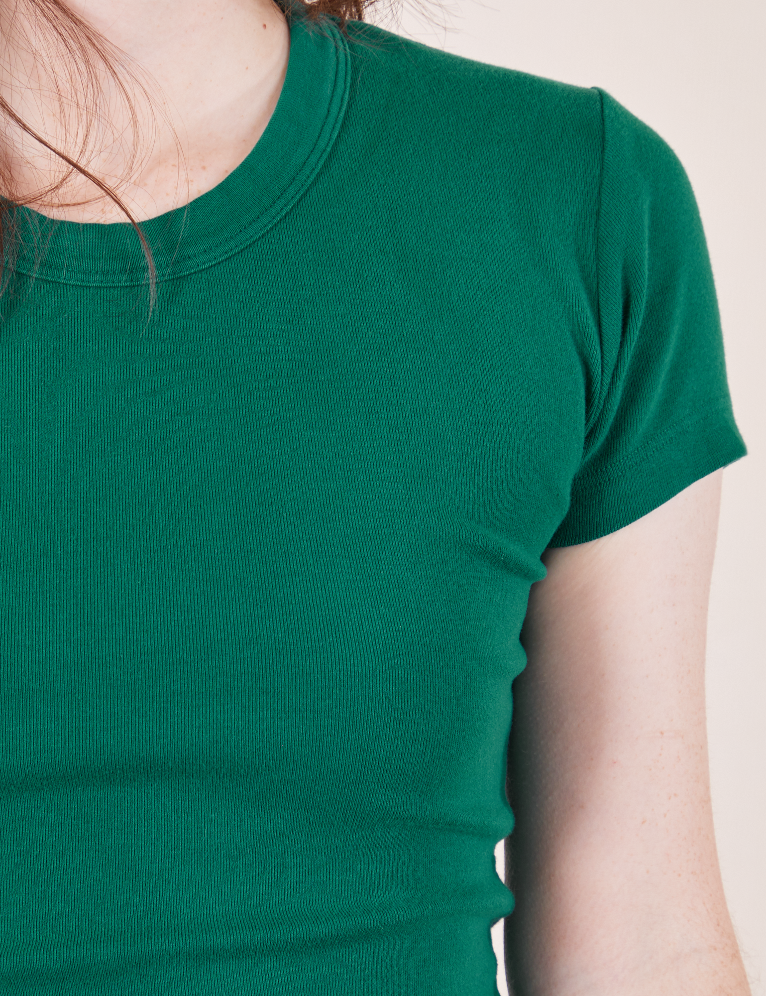 Front close up of Baby Tee in Hunter Green on Hana
