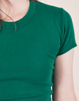Front close up of Baby Tee in Hunter Green on Hana