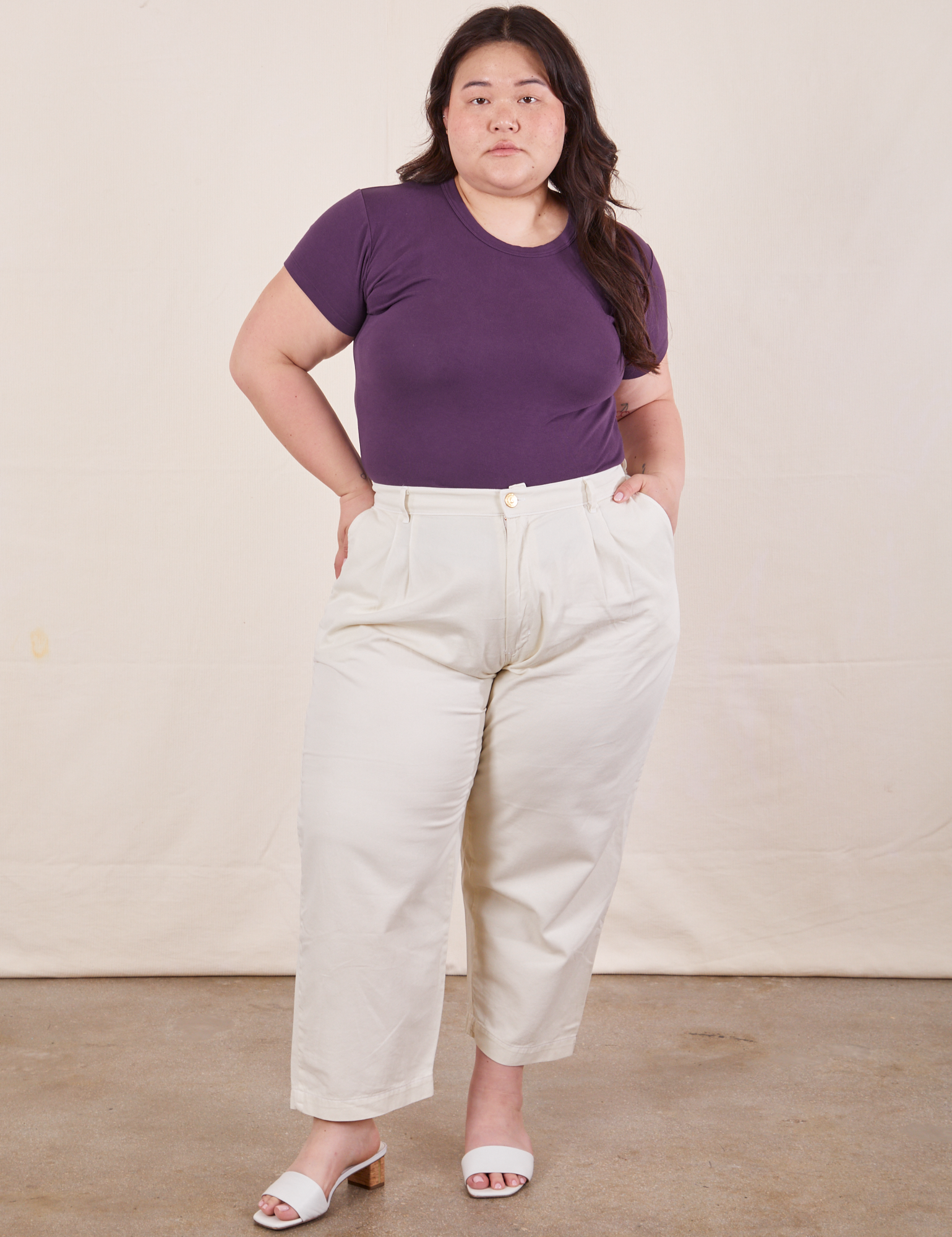 Ashley is wearing Baby Tee in Nebula Purple and vintage off-white Trousers
