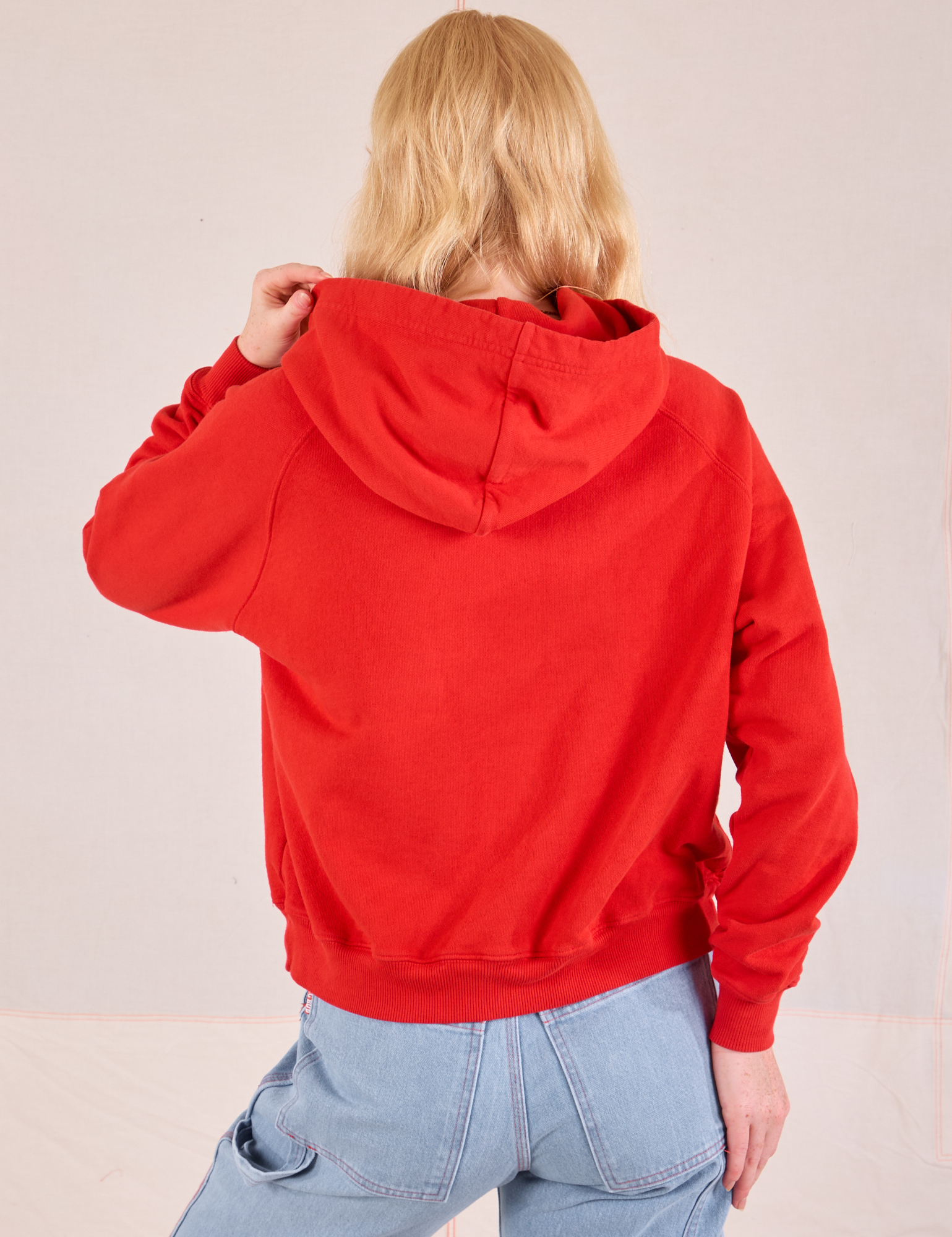 Collegiate Hoodie in Mustang Red back view on Margaret