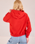 Collegiate Hoodie in Mustang Red back view on Margaret