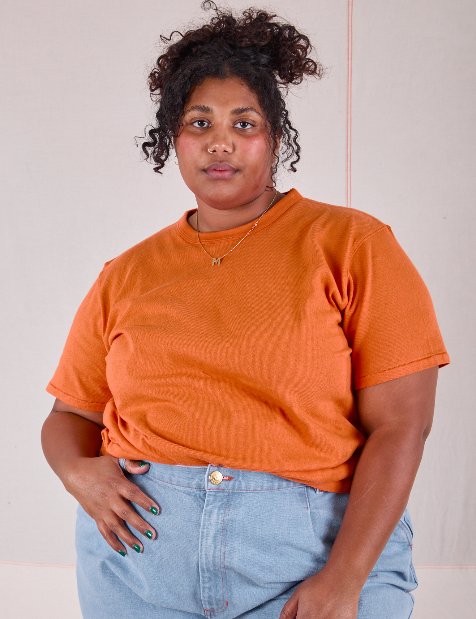 Burly Tee in Construction Orange tucked into light wash Denim Wide Leg Trousers on Morgan