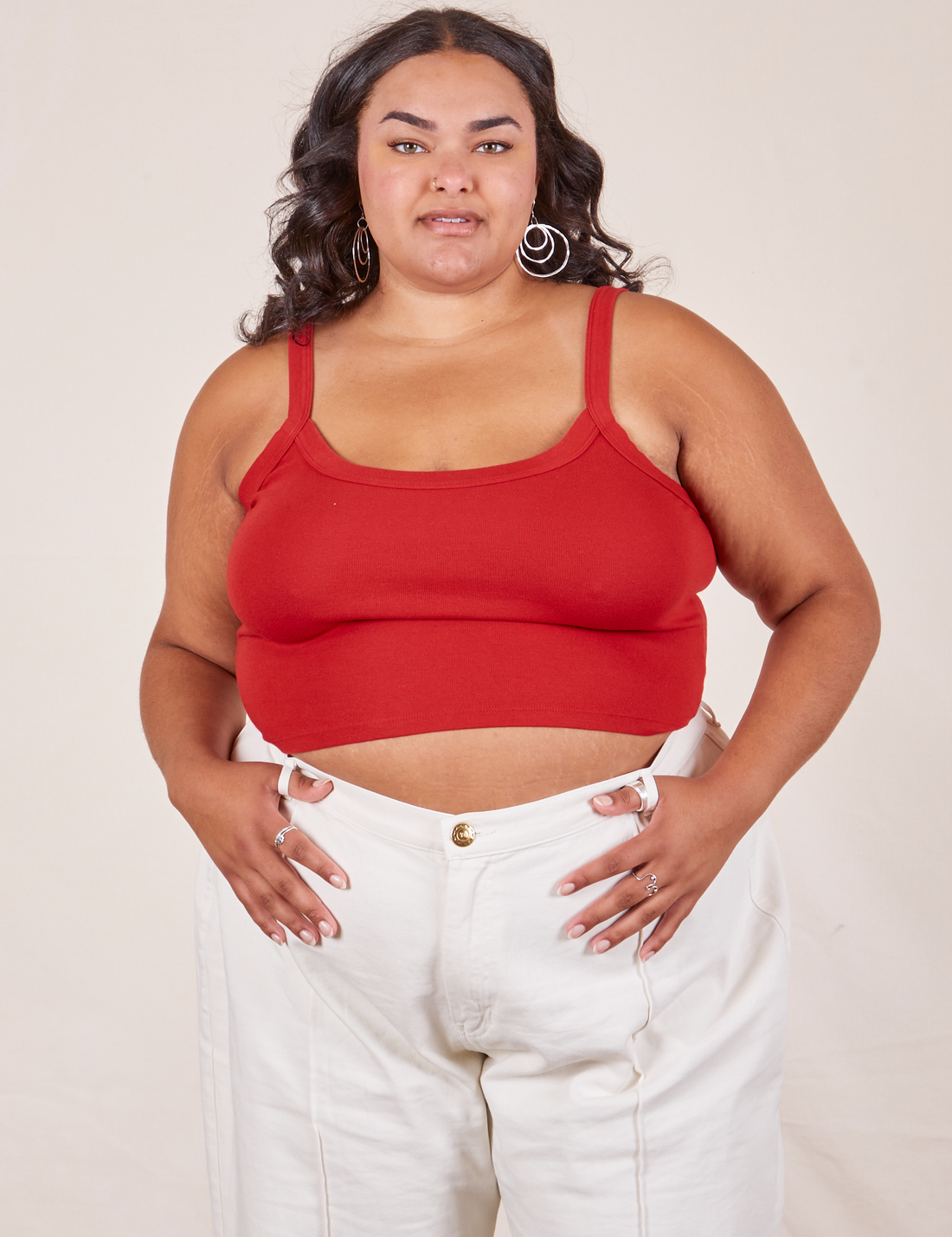 Alicia is 5'9" and wearing XL Cropped Cami in Mustang Red paired with vintage off-white Western Pants